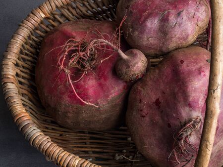 Fresh organic beetroot in a wicker basket, close up