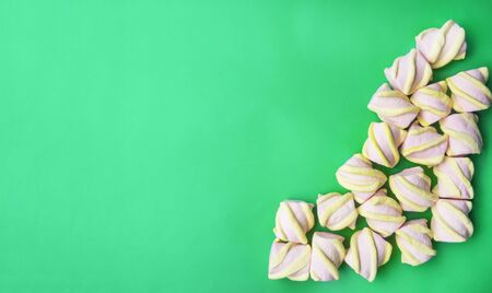 banner of tasty appetizing concept, minimal Sweet Treat Swirl Candy marshmallow on mint green...