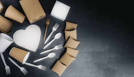 Paper and bamboo tableware, cartoon boxes, cups, cutlery for street food, fast food, picnic, no plastic concept, grey background. Eco friendly concept. Tonedの写真素材