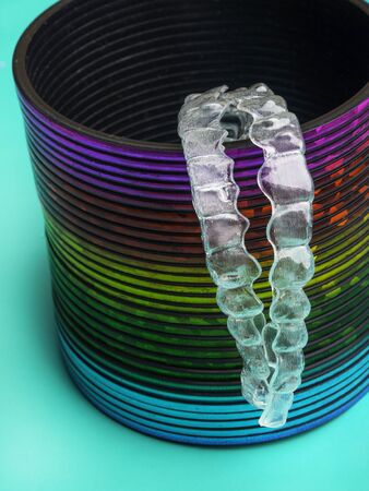 Invisible dental teeth brackets or aligners to straighten teeth. Orthodontic temporary removable...