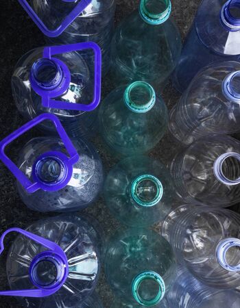 Rows of water bottles background, close up