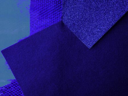 Paper background with paper texture in different blue tones Light blue with deep blue. Geometric sheets of paper. Trendy color of 2020の写真素材