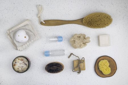 bath accessories, soaps, body brush, scrub with rose leaves, bottles for cosmetic, sponge on white...