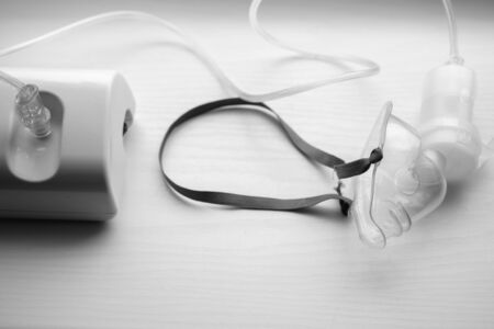 Ultrasonic inhaler or nebulizer on white background. Respiratory medicine. Asthma breathing treatment with oxygen mask, medical equipment for inhalation, respiratory mask for bronchitis healthの写真素材