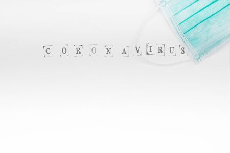 face medical mask on white background, with coronovirus protection concept, copy spaceの写真素材