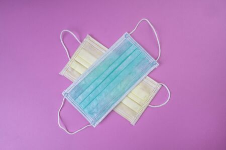 two medical surgical flu ilness protective face masks, help reduce the spread of the virus between...