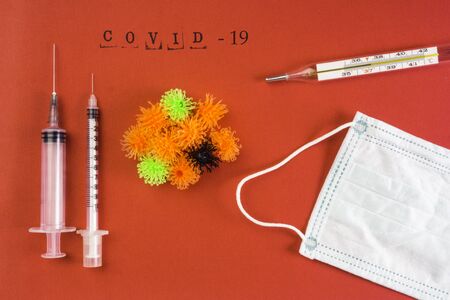 syringe vaccine of virus convid 19, face mask in background, medical concept , stop epidemic of new virus by medical treatment, recovery from coronavirus COVID-19, nCoVの写真素材