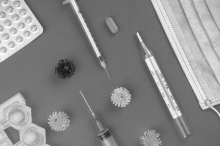 Protective medical mask, thermometer, pills, Sodium chloride, syringe and viruses, novel coronavirus...