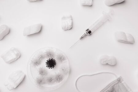 Protection medical mask against the virus molecules , syringes for injections, Virus pandemic concept concept, Pandemic virus protection, white and blackの写真素材