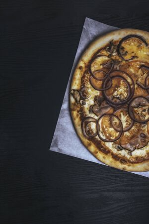 delicious ham bacon mushroom pizza. Traditional pastry. Fast food for partyの写真素材