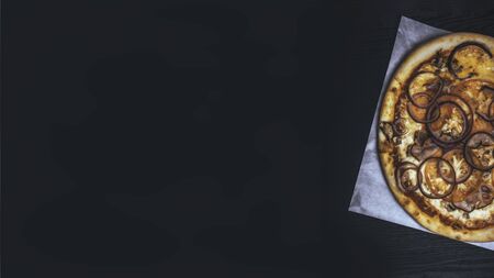 delicious ham bacon mushroom pizza. Traditional pastry. Fast food for party, creative toned, copy space, bannerの写真素材