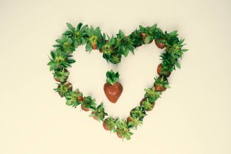 heart of organic fresh strawberry, array heart shape, beautiful card, soft focusの写真素材
