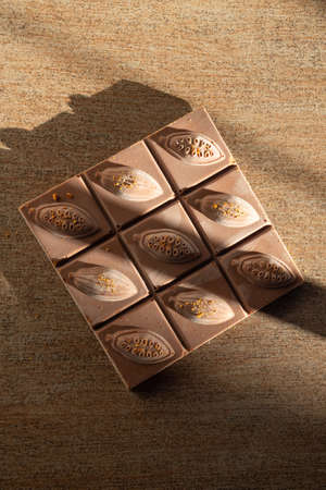 chocolate bar with trendy sunny shadows, energy and antioxidants rich sweets, selective focus, copy spaceの写真素材