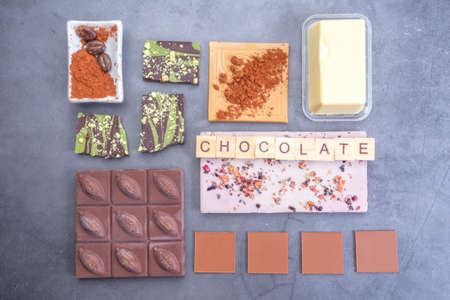 assorted colorful chocolate bar. Sweets dessert of various black milk white chocolate collection. Dessert, sweet realistic snack. Selective focusの写真素材