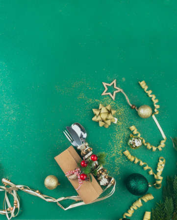 Christmas Green Festive Background with Cutlery, Holiday Setting Decorated with branches, red...