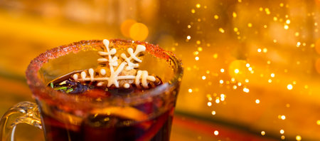 Mulled Christmas wine with orange, spices and snowflake gingerbread cake.の写真素材