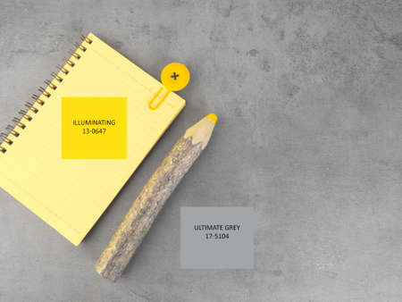 yellow notebook, wooden pencil on the ultimate gray background. To do list. Flat lay design with copy space. Color 2021の写真素材