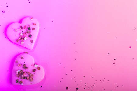 Valentines day heart shaped cookies dry strawberries on pink background with confetti. Top view. Copy space. Love concept, Valentines day treatsの写真素材