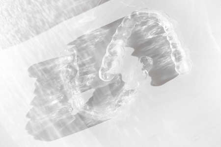 Invisible transparent aligners plastic braces dentistry retainers to straighten teeth with beautiful...