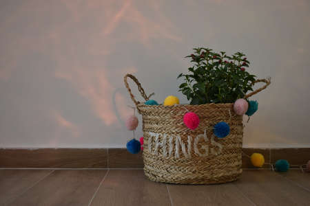 A vase of flowers decorated with decor and multi-colored ballsの写真素材