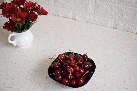 An appetizer with fresh red cherriesの写真素材