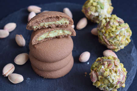 Delicious cookies with chocolate and pistachio.の写真素材