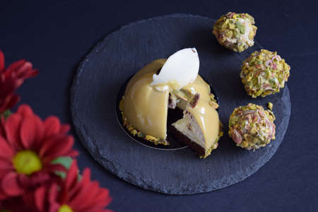 Very tasty cake with chocolate and pistachio.の写真素材