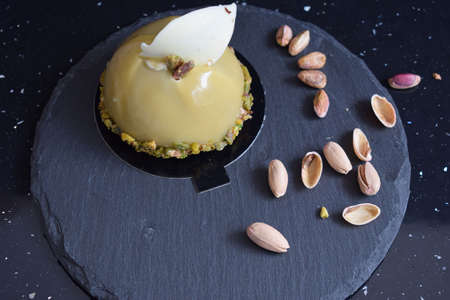 Very tasty cake with chocolate and pistachio.の写真素材