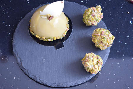Very tasty cake with chocolate and pistachio.の写真素材