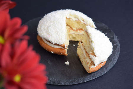 Coconut cake on a black backgroundの写真素材