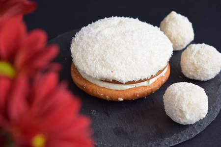 Coconut cake on a black backgroundの写真素材