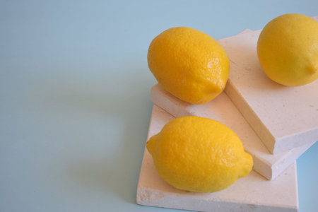 Fresh lemons on a blue backgroundの写真素材