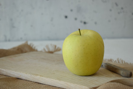 Ripe yellow apple is fresh in the kitchenの写真素材