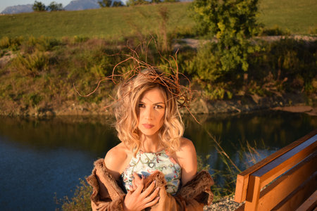 portrait of a beautiful woman in a wonderful autumn natureの写真素材