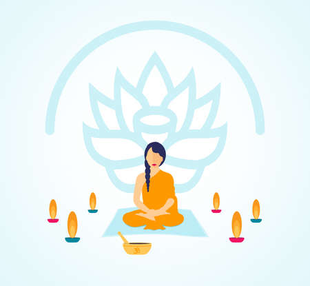 Woman Meditating Surrounded by Candles and a Lotus Flowerの写真素材