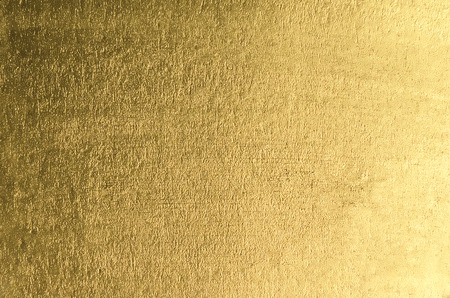Gold background. Gold metallic texture. Trendy template for holi