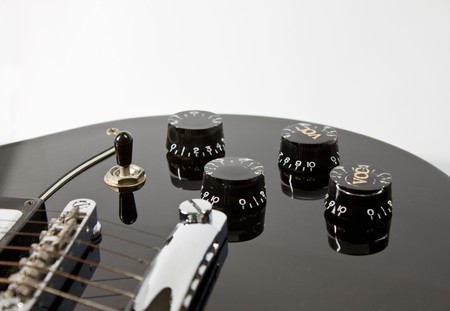 Black guitar with volume adjustmentの写真素材