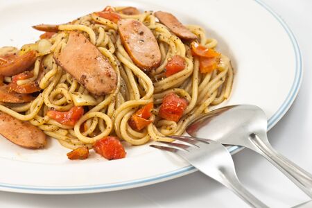 Black pepper spaghetti with sausage in plateの写真素材