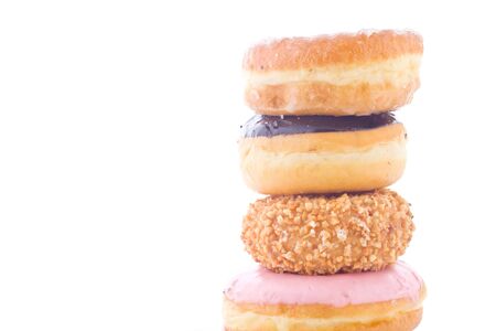 Stack of delicious sweet donut mix on  white backgroundの写真素材