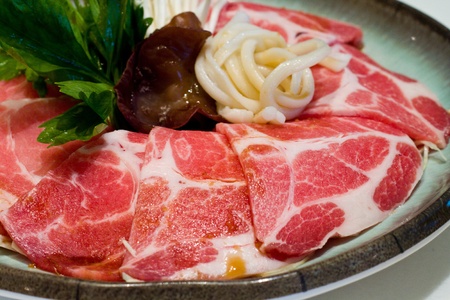 Raw fresh meat in sukiyaki restaurant with  vegetable and japanese noodleの写真素材