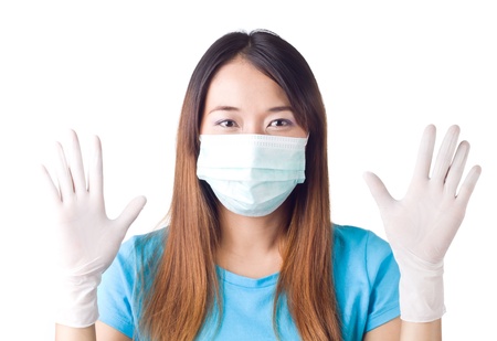 Nurse showing her surgical glove on  white backgroundの写真素材