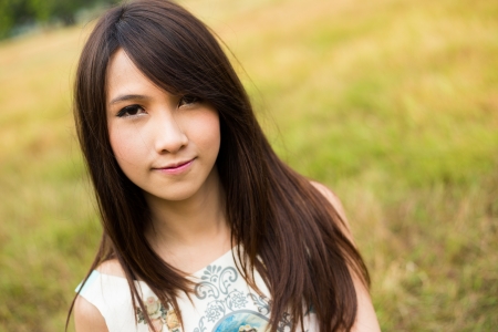 Beauty young woman headshot in natureの写真素材