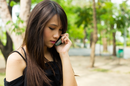Young woman using mobile phoneの写真素材