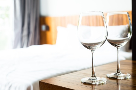 Wine glasses in bed roomの写真素材