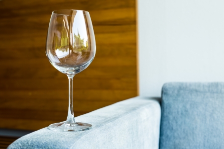 Wine glass on the sofa in the roomの写真素材