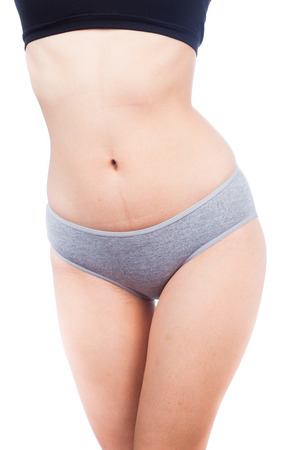 Beautiful female body isolated on whiteの写真素材