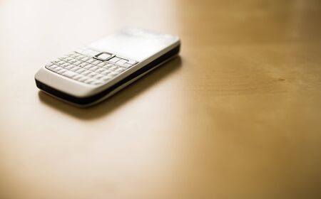 Smart mobile  phone on wood floorの写真素材