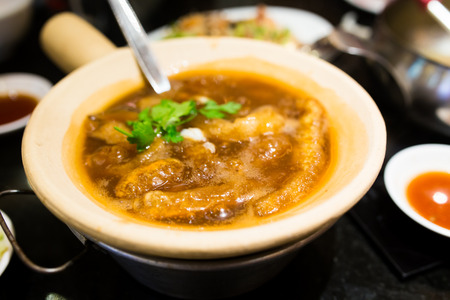 Fish Maw Soup with sauce in restaurantの写真素材