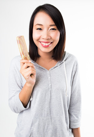 Woman with a combの写真素材