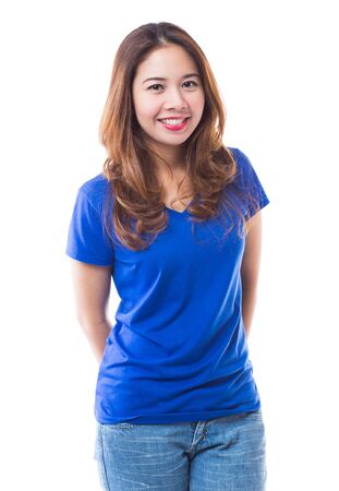 Beautiful brunette girl in jeans and blue t-shirt smiling on white backgroundの写真素材